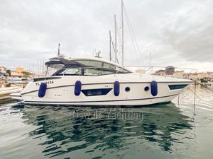 Beneteau Gran Turismo 40 2018 Beneteau Gran Turismo 40 yacht docked in a marina, side view.
