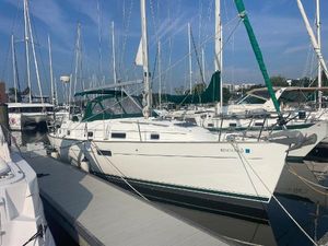 Beneteau Oceanis 36 CC 1999 Beneteau Oceanis 36 CC sailboat docked at marina under clear blue sky.