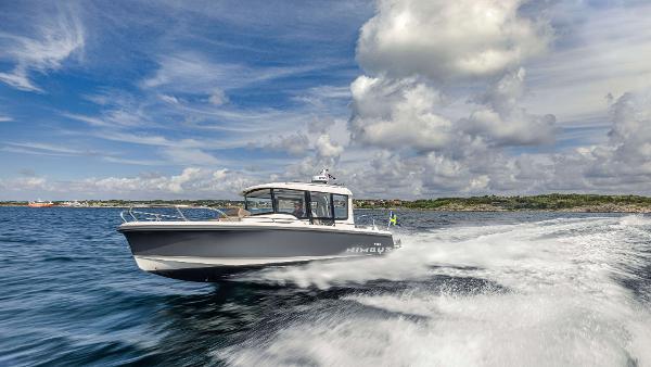 Nimbus Commuter 8 2025 Nimbus Commuter 8 boat cruising on open water under a cloudy sky.