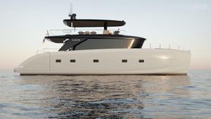 Bluegame BGM75 2025 Bluegame BGM75 yacht on calm water at sunset.