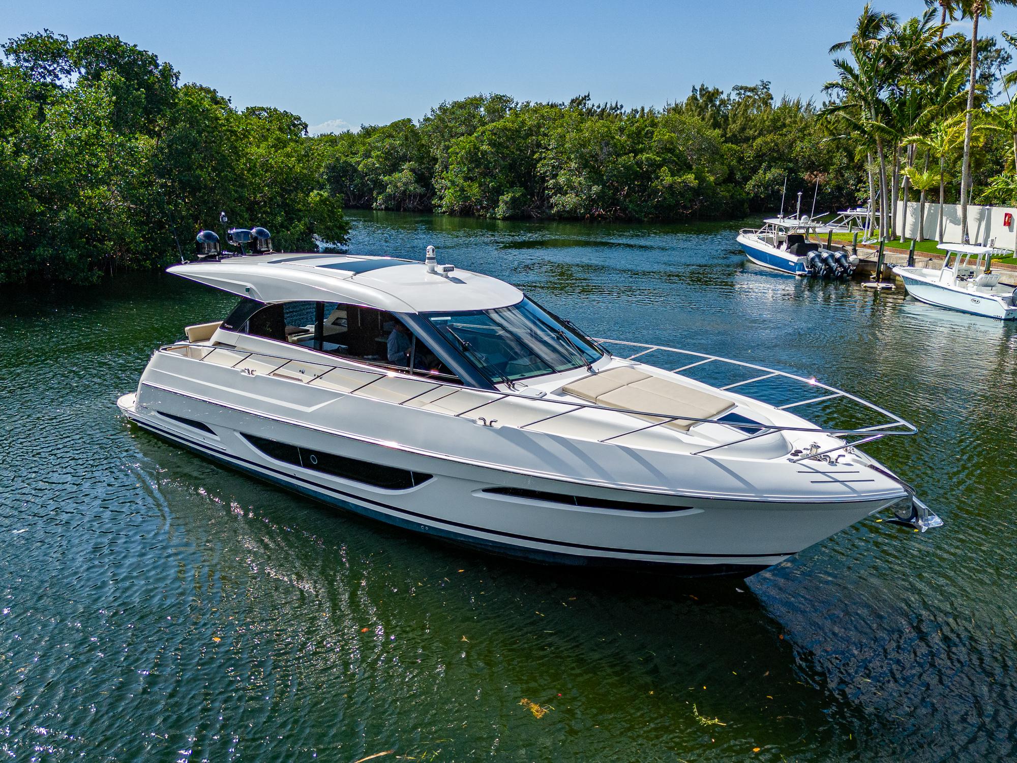 Maritimo X50 2020 Maritimo X50 luxury yacht cruising on a scenic waterway.