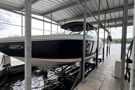 Cobalt 302 2007 Cobalt 302 boat docked in a covered marina slip.
