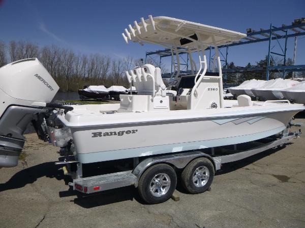 Ranger 2360 Bay 2024 Ranger 2360 Bay boat on a trailer with a Mercury outboard motor.