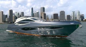 Numarine 78 Luxurious 2019 Numarine 78 yacht cruising near a city skyline.