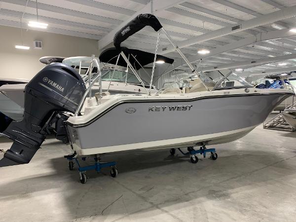 Key West 203 DFS 2024 Key West 203 DFS boat in showroom with Yamaha outboard motor.