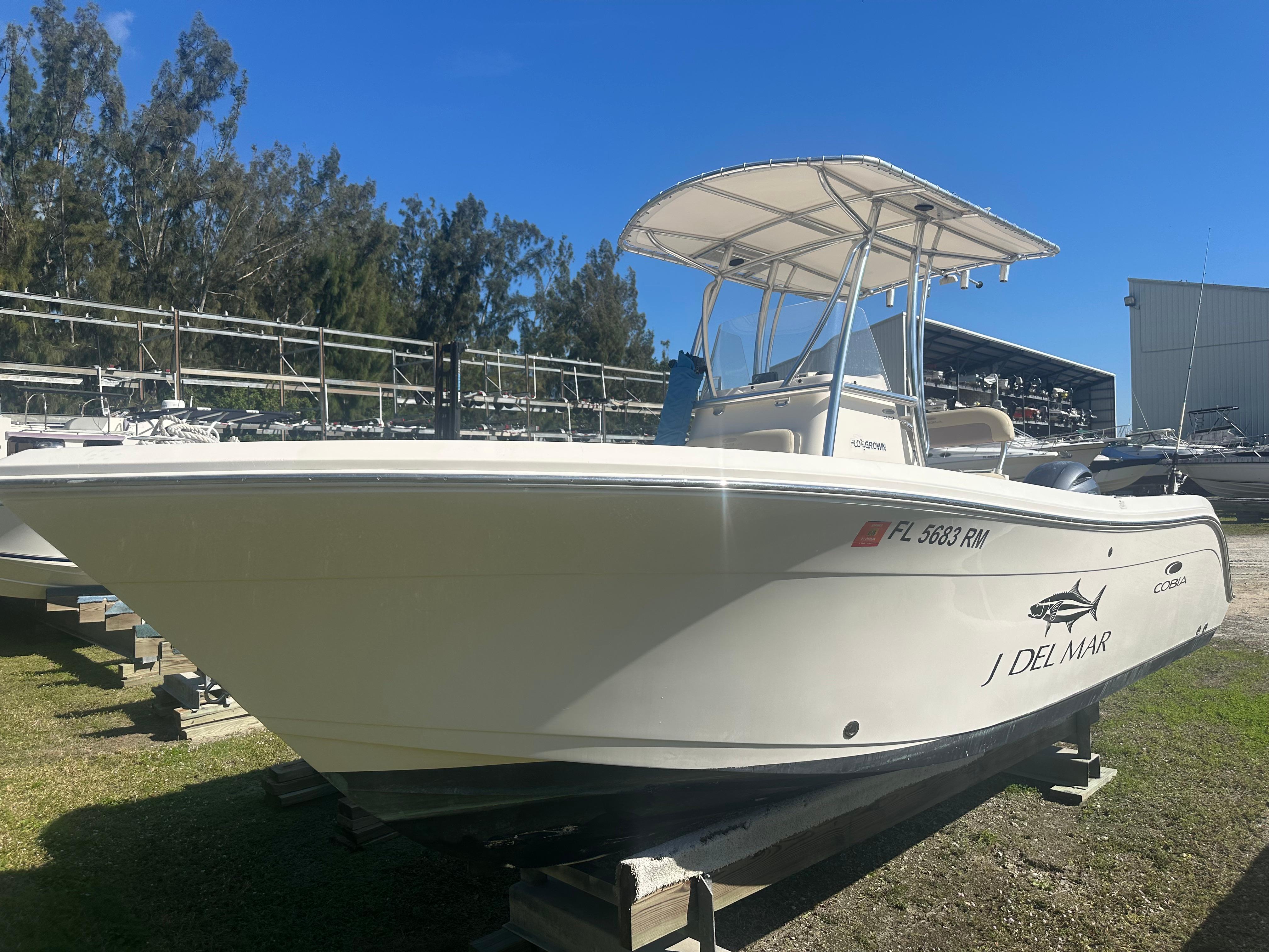 Cobia 220 Center Console 2018 Cobia 220 Center Console boat on display outdoors.
