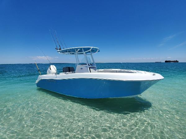 Aquasport 2300 Center Console 2022 Aquasport 2300 Center Console boat on clear blue water under a sunny sky.