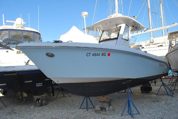 Everglades 255 Center Console 2014 Everglades 255 Center Console boat on stands in a marina.