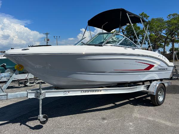 Chaparral 19 SSi 2024 Chaparral 19 SSi boat on trailer with black canopy.