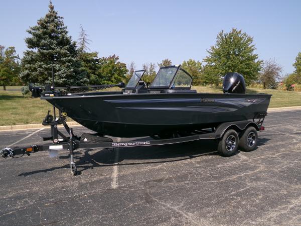 Ranger VX1888 WT 2024 Ranger VX1888 WT boat on trailer in parking lot.