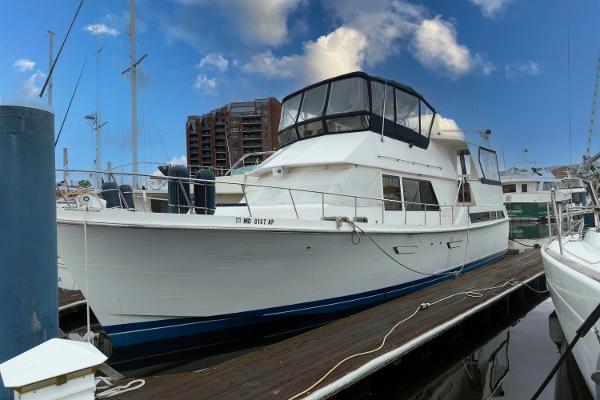 Marine Trader 48 Trawler 1988 Marine Trader 48 Trawler docked at marina under blue sky.