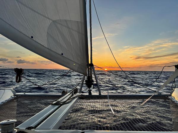 Lagoon 42 Lagoon 42 catamaran sailing at sunset, 2019 model, open sea view.