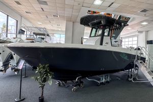 Wellcraft 263 Fisherman 2024 Wellcraft 263 Fisherman boat displayed in a showroom, featuring sleek design and modern amenities.