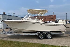 Grady-White Freedom 235 2026 Grady-White Freedom 235 boat on trailer, parked outdoors.