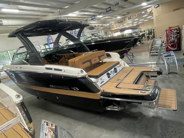 Chaparral 267 SSX 2025 Chaparral 267 SSX boat in showroom, featuring sleek design and spacious deck.