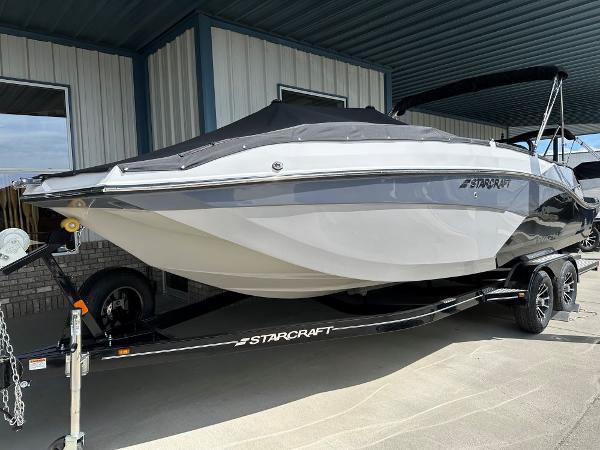 Starcraft SVX 231 OB DH 2024 Starcraft SVX 231 OB DH boat on trailer, covered and parked.