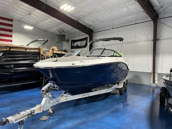 Sea Ray SPX 210 Outboard 2025 Sea Ray SPX 210 OB boat on trailer in showroom.