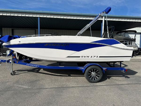 Starcraft SVX 171 OB 2024 Starcraft SVX 171 OB boat on a blue trailer.