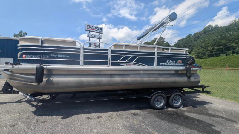 Sun Tracker Party Barge 22 RF XP3 2020 Sun Tracker Party Barge 22 RF XP3 pontoon boat on trailer, outdoors under blue sky.
