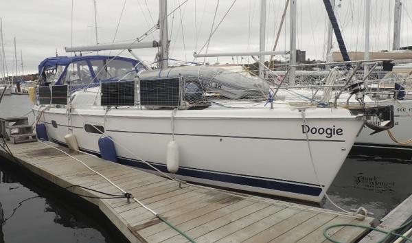 Hunter 410 Hunter 410 sailboat from 2002 docked at a marina, named "Doogie."