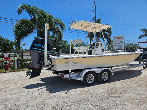Pathfinder 2400 Tournament 2011 Pathfinder 2400 Tournament Edition boat with Yamaha engine on trailer, parked outdoors.