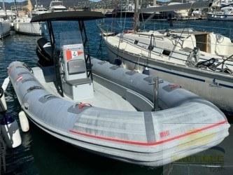 Marshall M6 2017 Marshall M6 inflatable boat docked in marina, alongside sailboats.