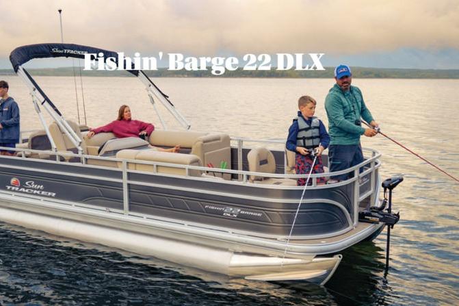 Sun Tracker Fishin' Barge 22 DLX 2026 Sun Tracker FISHIN' BARGE® 22 DLX pontoon boat on a serene lake.