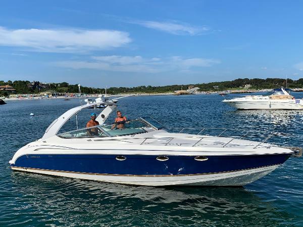 Formula 370 Super Sport 2002 Formula 370 Super Sport boat cruising on a sunny day in a scenic bay.