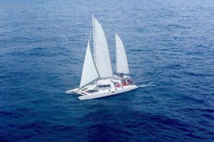 Custom CATAMARAN CUSTOM 60' Aerial view of a 1996 Custom CATAMARAN CUSTOM 60' sailing on open ocean.