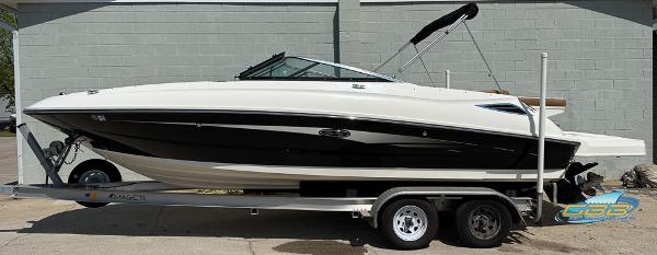 Sea Ray 240 Sundeck 2015 Sea Ray 240 Sundeck boat on trailer, side view, black and white design.