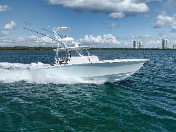 Jupiter 40 2023 Jupiter 40 boat cruising on open water under a partly cloudy sky.
