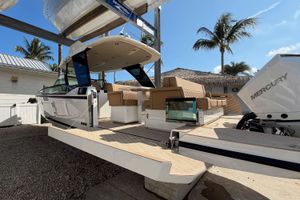 Saxdor 320 GTO Saxdor 320 GTO 2026 with Mercury engine, modern design, palm trees in background.