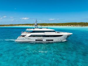 Custom Line Navetta 33 Luxurious 2018 Custom Line Navetta 33 yacht cruising in clear turquoise waters.