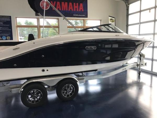 Sea Ray SPX 210 Outboard 2025 Sea Ray SPX 210 OB boat on trailer in showroom.