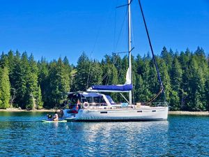Beneteau Oceanis 45 Sailboat Beneteau Oceanis 45 (2014) anchored on a serene lake with lush forest backdrop.