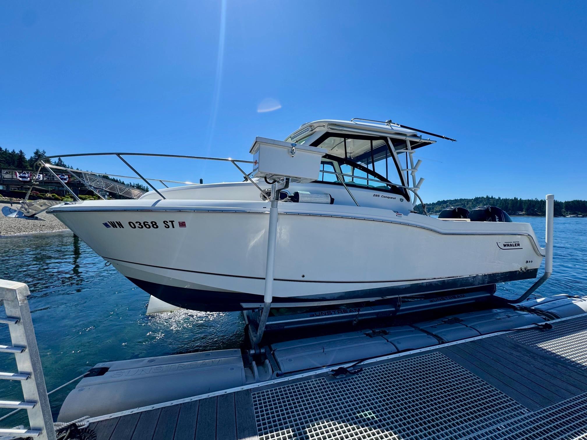 Boston Whaler 285 Conquest 2018 Boston Whaler 285 Conquest boat docked on a sunny day.