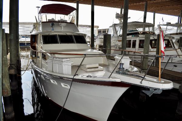 Hatteras 53 Motor Yacht 1981 Hatteras 53 Motor Yacht docked in a marina, showcasing classic design and elegance.