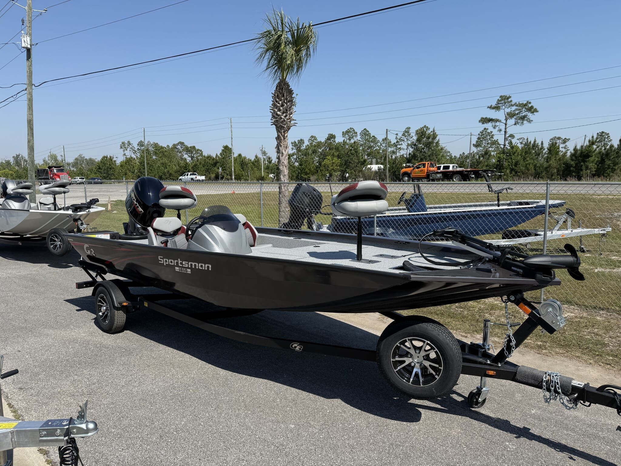 G3 Sportsman 1810 2025 G3 Sportsman 1810 boat on trailer, parked outdoors under clear sky.