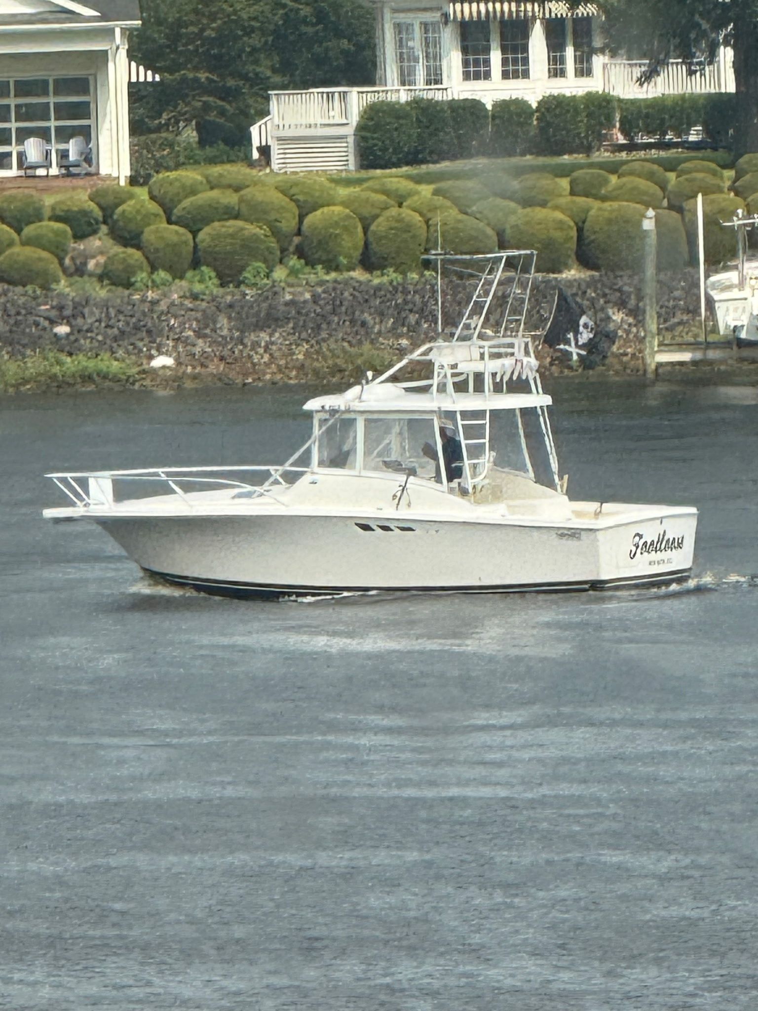 Luhrs Tournament 290 Open 1993 Luhrs Tournament 290 Open boat cruising near a scenic waterfront property.
