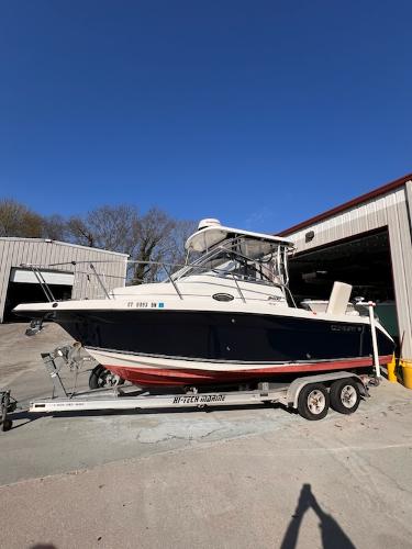 Century 2400 Walkaround 2008 Century 2400 Walkaround boat on trailer, parked outside a storage facility.