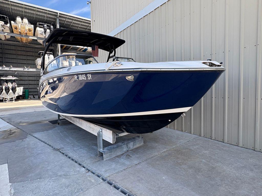 Yamaha Boats 252SE 2021 Yamaha Boats 252SE in storage, blue hull, docked at marina.