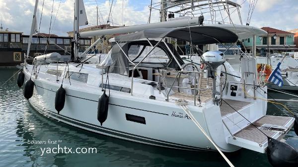 Hanse 388 2022 Hanse 388 yacht docked in marina, featuring sleek design and modern amenities.
