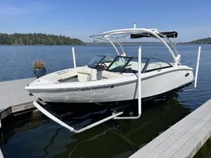 Cobalt CS1 2017 Cobalt CS1 boat docked on a serene lake with clear blue skies.