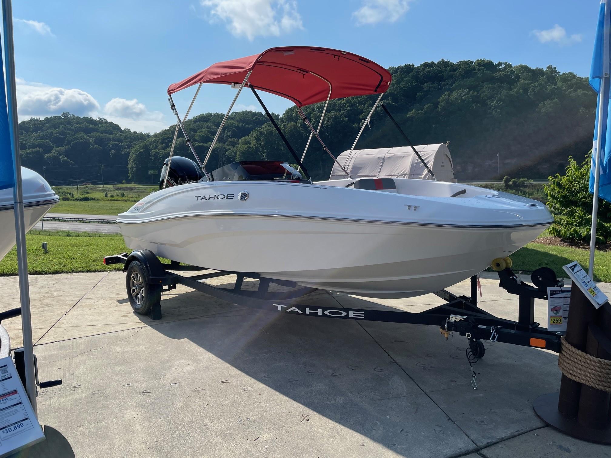 Tahoe T16 2025 Tahoe T16 boat with red canopy on trailer, displayed outdoors.