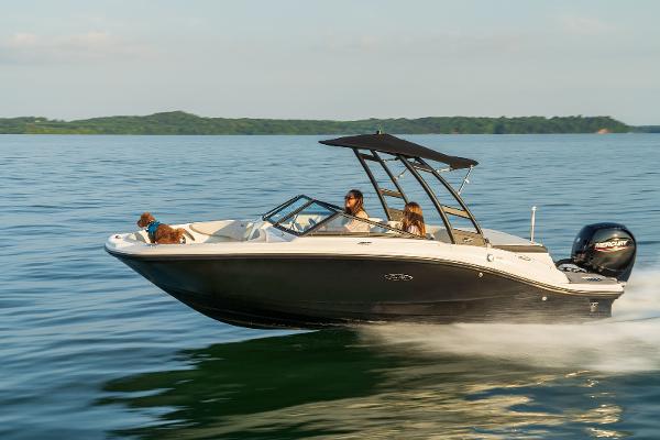 Sea Ray SPX 190 2023 Sea Ray SPX 190 boat cruising on a lake with passengers and a dog.