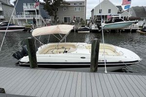 NauticStar 210 DC Sport Deck 2006 NauticStar 210 DC Sport Deck boat docked in a marina with houses in the background.