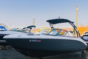 Chaparral 210 Suncoast 2018 Chaparral 210 Suncoast boat displayed outdoors on a sunny day.