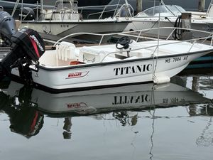Boston Whaler 150 Sport 2003 Boston Whaler 150 Sport boat named "Titanic" docked with Mercury engine.
