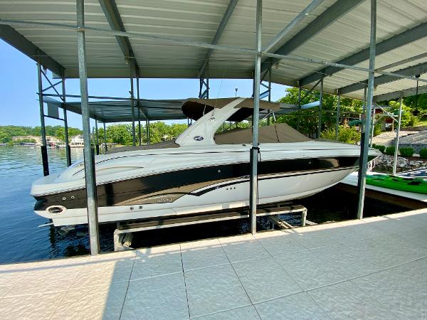 Sea Ray 290 Bowrider 2001 Sea Ray 290 Bowrider docked under a covered marina, side view.