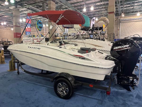 Tahoe T16 2025 Tahoe T16 boat with Mercury engine on display indoors.